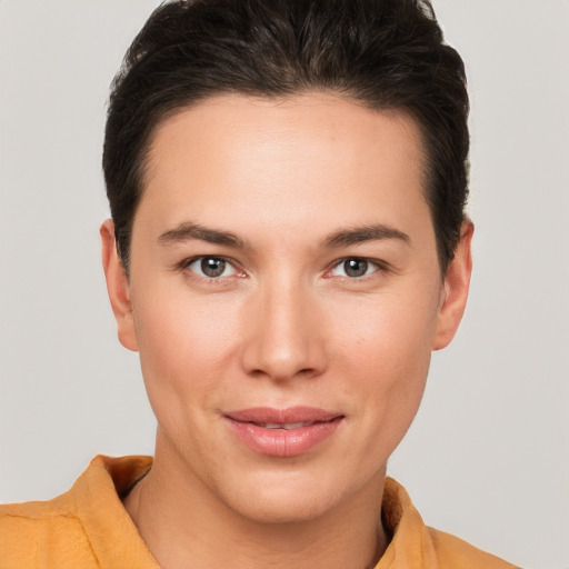 Joyful white young-adult female with short  brown hair and brown eyes