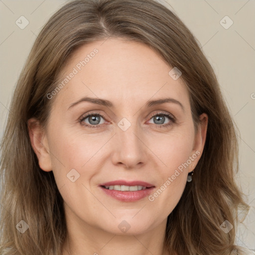 Joyful white adult female with medium  brown hair and grey eyes