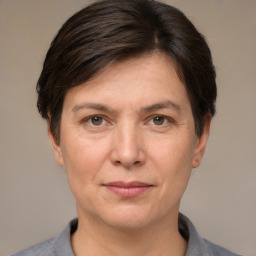 Joyful white adult female with short  brown hair and brown eyes