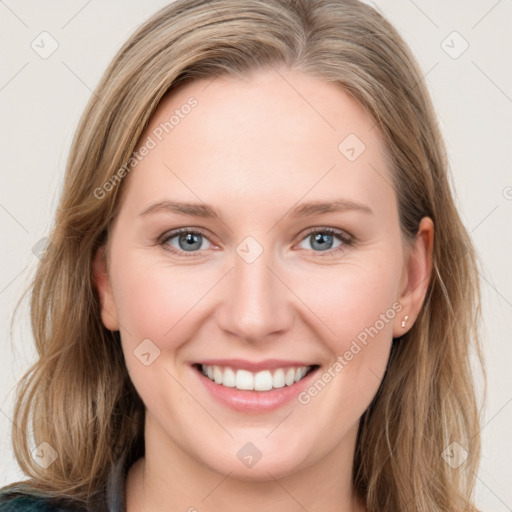 Joyful white young-adult female with long  brown hair and blue eyes