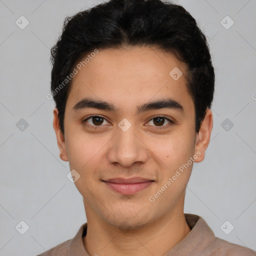 Joyful latino young-adult male with short  black hair and brown eyes