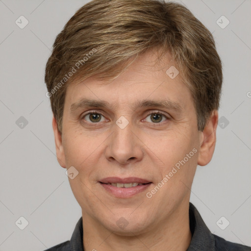 Joyful white adult male with short  brown hair and grey eyes