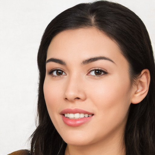 Joyful asian young-adult female with long  black hair and brown eyes