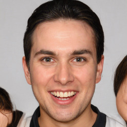 Joyful white adult male with medium  brown hair and brown eyes