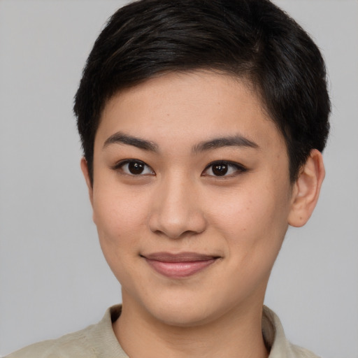 Joyful asian young-adult female with short  brown hair and brown eyes