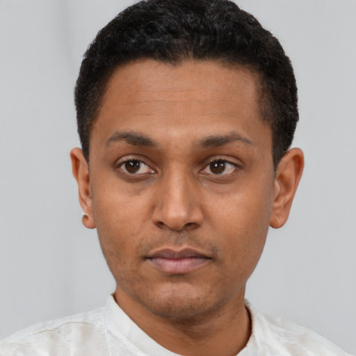 Neutral latino young-adult male with short  black hair and brown eyes