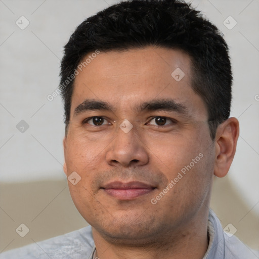 Joyful asian young-adult male with short  black hair and brown eyes