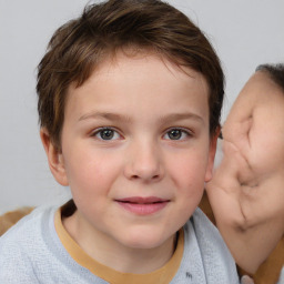 Joyful white child female with short  brown hair and brown eyes