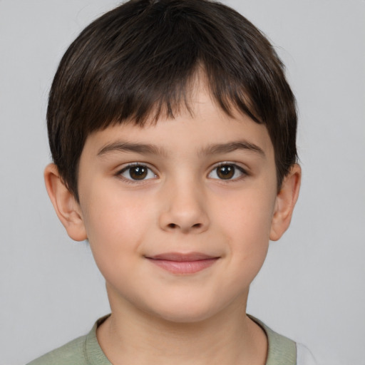 Joyful white child male with short  brown hair and brown eyes