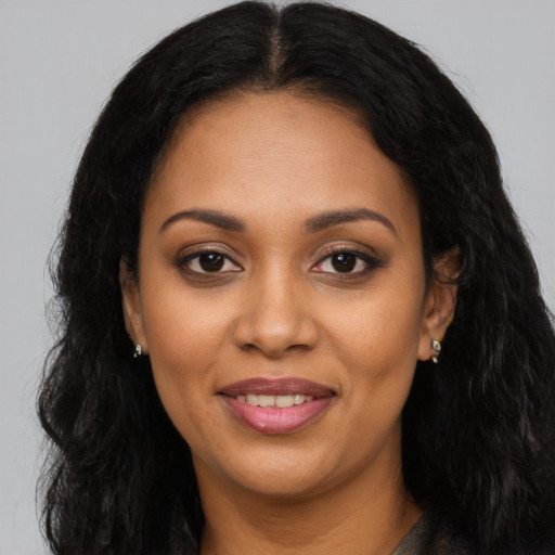 Joyful latino young-adult female with long  black hair and brown eyes