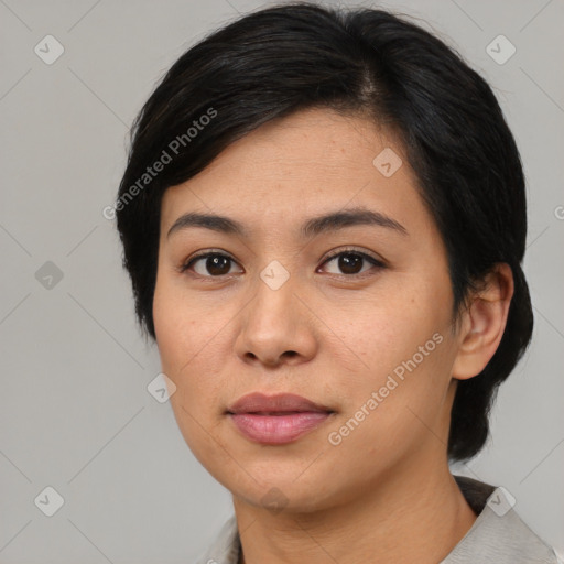 Joyful asian young-adult female with medium  black hair and brown eyes