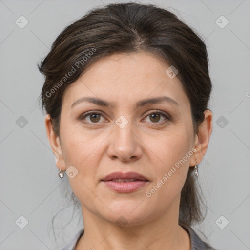 Joyful white adult female with medium  brown hair and grey eyes