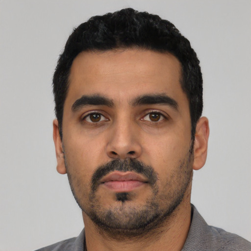 Neutral latino young-adult male with short  black hair and brown eyes