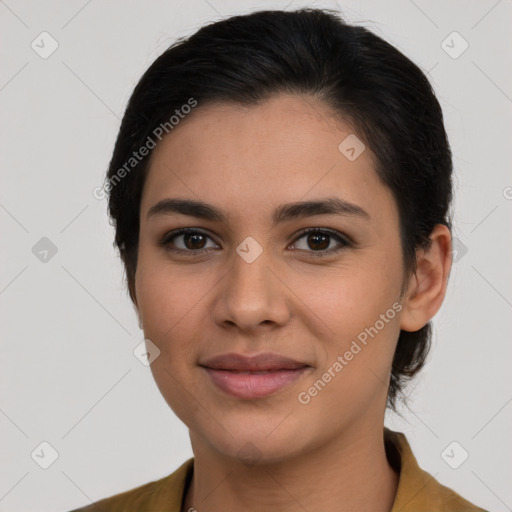 Joyful latino young-adult female with medium  brown hair and brown eyes