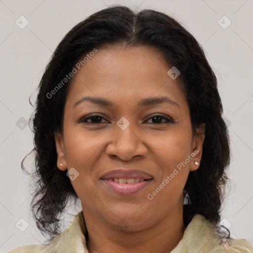 Joyful black adult female with medium  brown hair and brown eyes