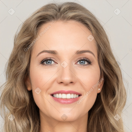 Joyful white young-adult female with long  brown hair and green eyes