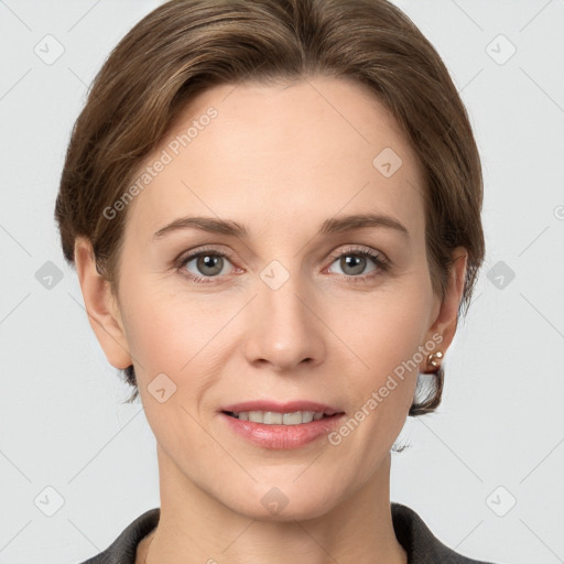 Joyful white young-adult female with medium  brown hair and grey eyes