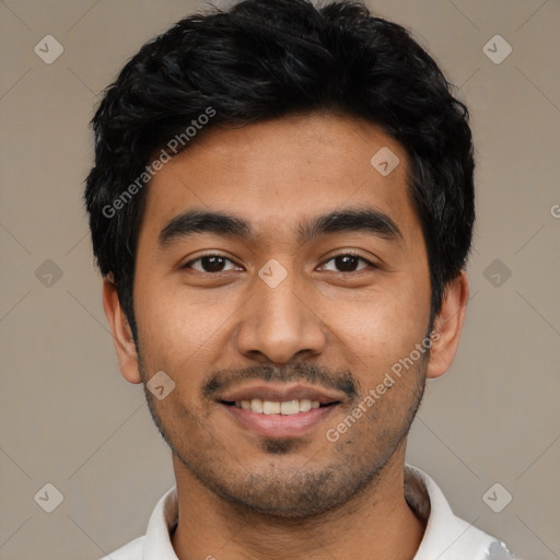 Joyful latino young-adult male with short  black hair and brown eyes