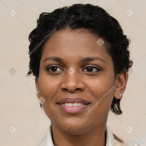 Joyful black young-adult female with short  brown hair and brown eyes