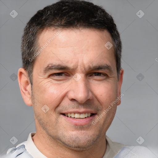 Joyful white adult male with short  brown hair and brown eyes