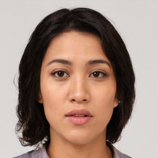 Neutral latino young-adult female with medium  brown hair and brown eyes