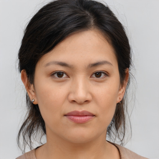 Joyful asian young-adult female with medium  brown hair and brown eyes