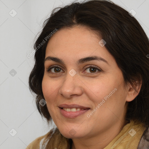 Joyful white adult female with long  brown hair and brown eyes