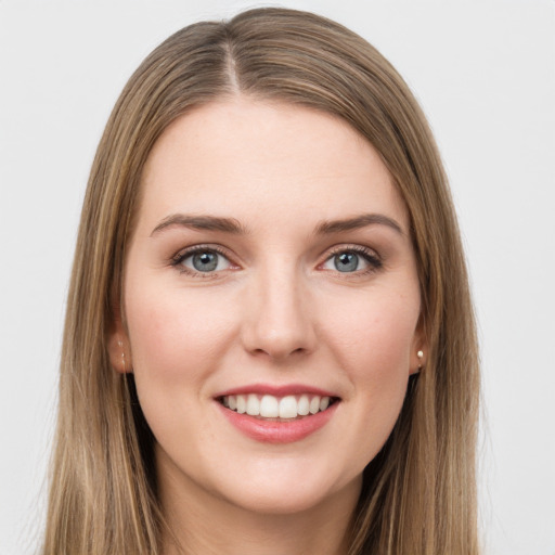 Joyful white young-adult female with long  brown hair and grey eyes