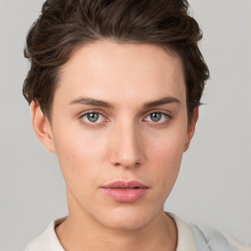 Neutral white young-adult female with short  brown hair and brown eyes