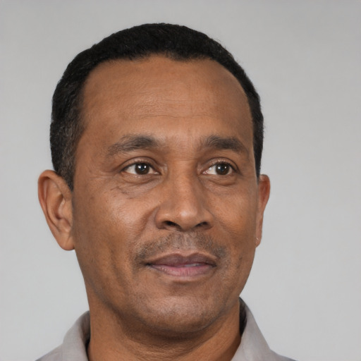 Neutral latino adult male with short  black hair and brown eyes