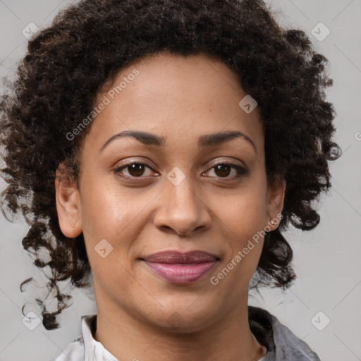 Joyful black adult female with medium  brown hair and brown eyes