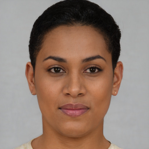 Joyful latino young-adult female with short  brown hair and brown eyes