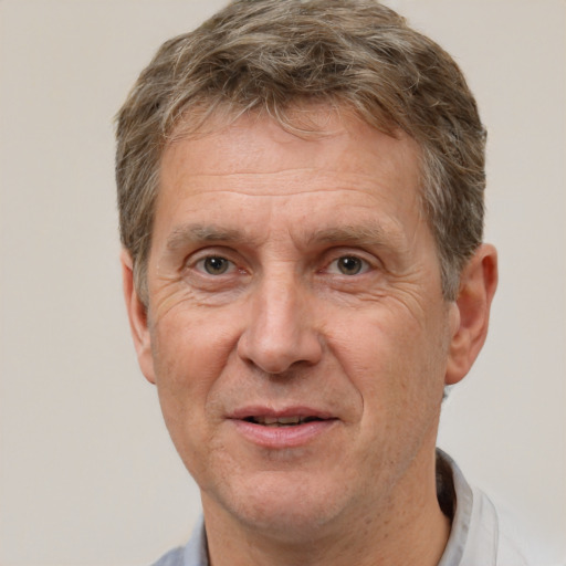 Joyful white middle-aged male with short  brown hair and brown eyes