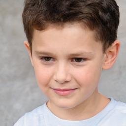 Joyful white child male with short  brown hair and brown eyes