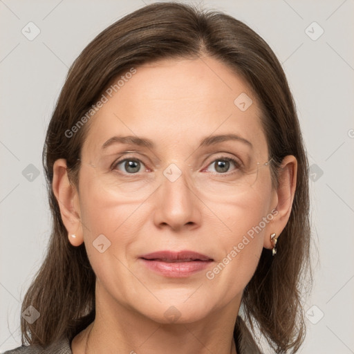 Joyful white adult female with medium  brown hair and grey eyes