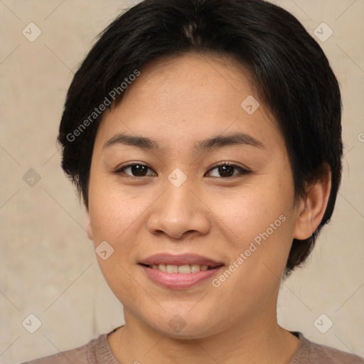 Joyful asian young-adult female with short  brown hair and brown eyes