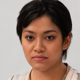 Neutral asian young-adult female with medium  brown hair and brown eyes