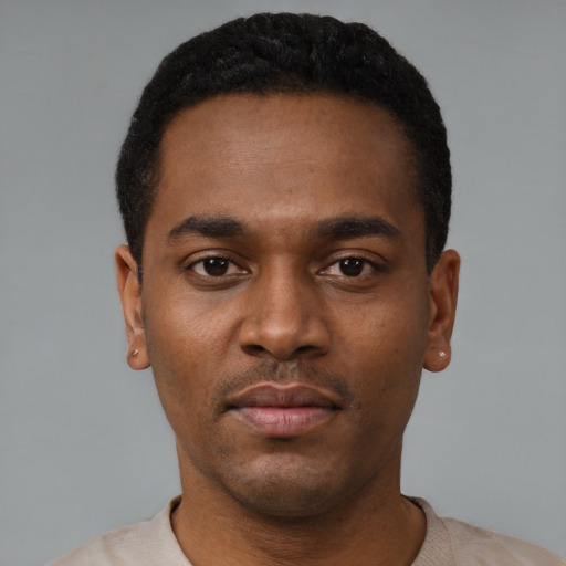 Neutral black young-adult male with short  black hair and brown eyes