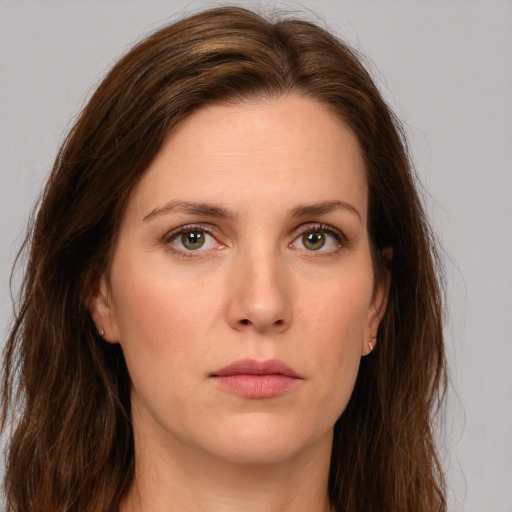 Neutral white young-adult female with long  brown hair and green eyes