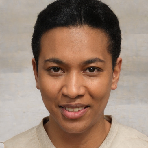 Joyful black young-adult male with short  black hair and brown eyes