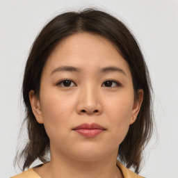 Neutral asian young-adult female with medium  brown hair and brown eyes