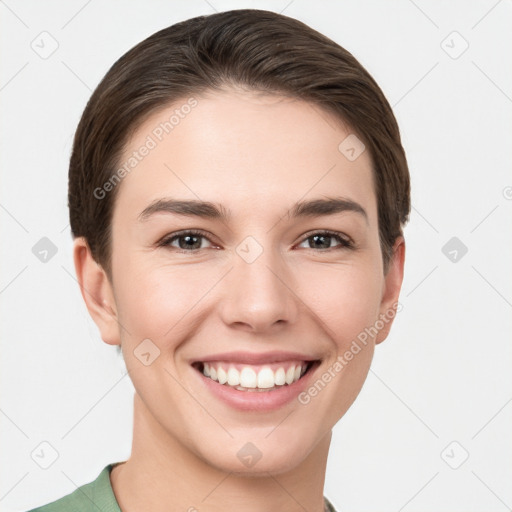 Joyful white young-adult female with short  brown hair and brown eyes