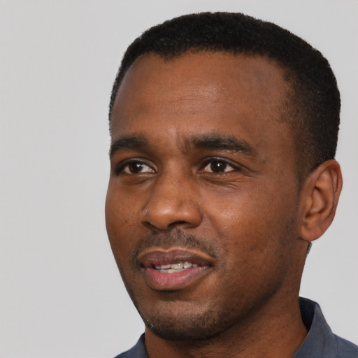 Neutral black young-adult male with short  black hair and brown eyes