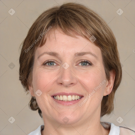 Joyful white adult female with medium  brown hair and grey eyes