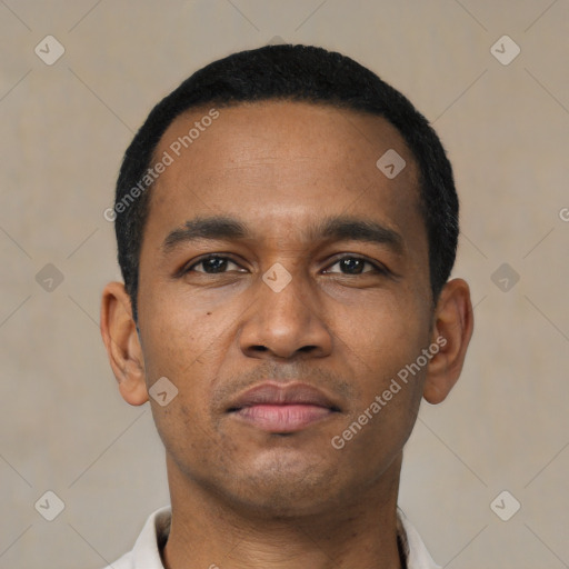 Neutral latino young-adult male with short  black hair and brown eyes