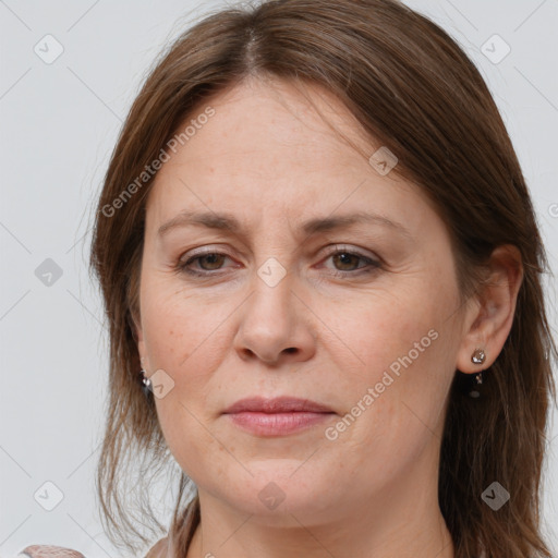 Joyful white adult female with long  brown hair and grey eyes