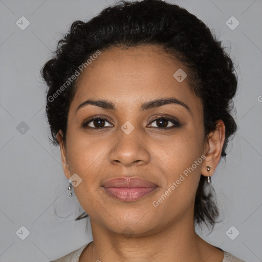 Joyful black young-adult female with medium  black hair and brown eyes