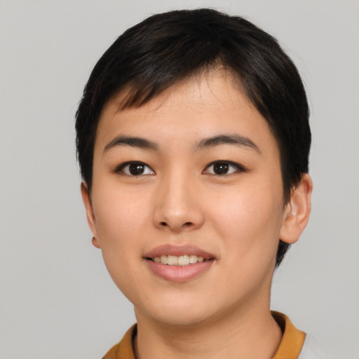 Joyful asian young-adult female with short  black hair and brown eyes