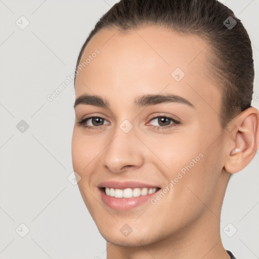 Joyful white young-adult female with short  brown hair and brown eyes