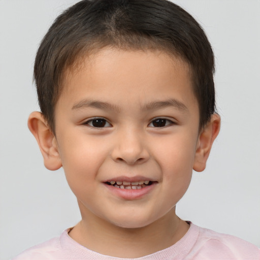 Joyful white child male with short  brown hair and brown eyes